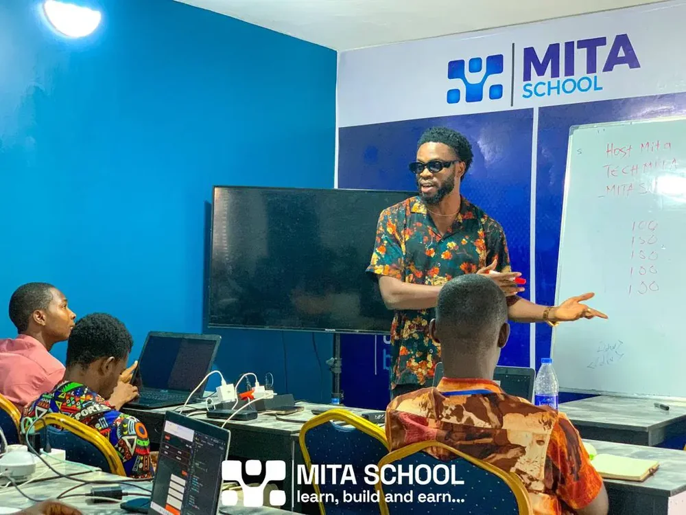 Mr. Lawson Godwin Hezekiah guiding a Mita School classroom session